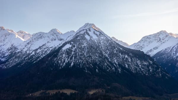 Breathtaking view of snowcapped mountains in Oberstdorf, Germany, under clear skies.