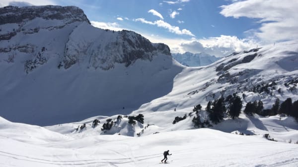 Skier on a sunny winter day in the Swiss Alps, Morschach, Switzerland.