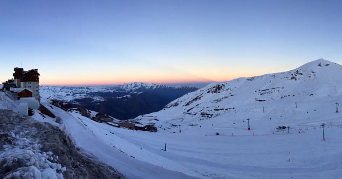 Snow-covered ski slopes at sunset above Lo Barnechea, Chile