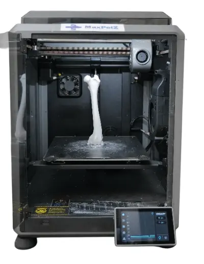 A medical 3D printer creating a custom surgical implant