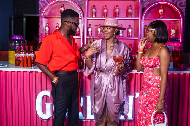 Three attendees of the Gordon's gin launch event talking