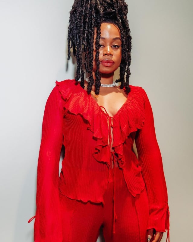 Sha Sha in red two piece top and pants