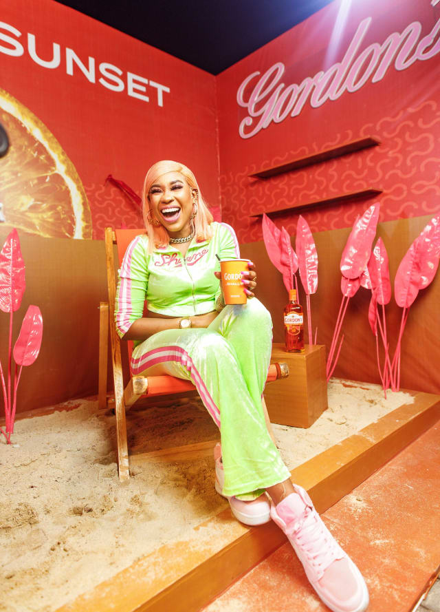 A woman laughing at the photo booth