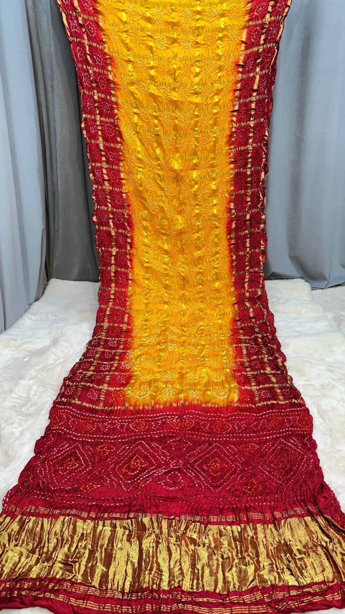 Modal Silk Fabric Saree with Lakdi Patta Zari Work & All Over Hand Bandhej Design
