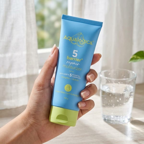 Aqualogica 5 Barrier+ Repair Moisturizer with Avocado & 5 Essential Ceramides - 100g held in hand, candid photo