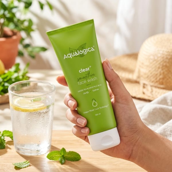 Aqualogica Clear+ Smoothie Face Wash 100 ml held in hand, candid photo