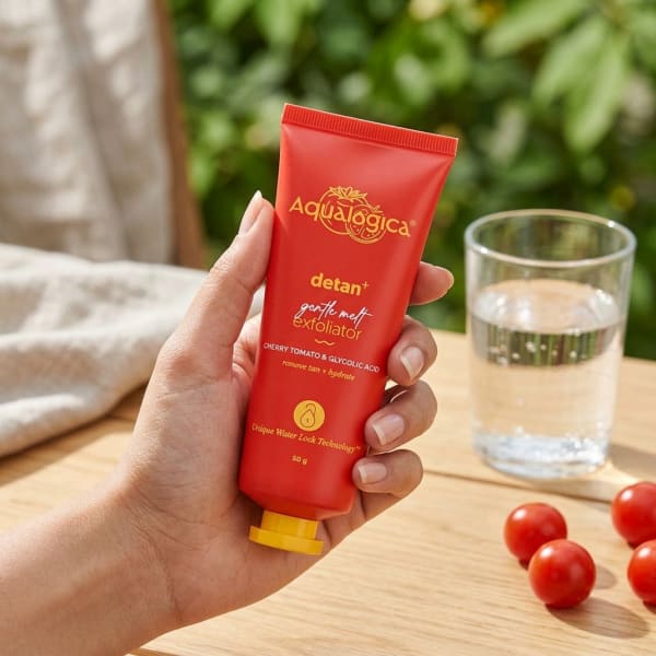 Aqualogica Detan+ Gentle Melt Exfoliator held in hand, candid photo