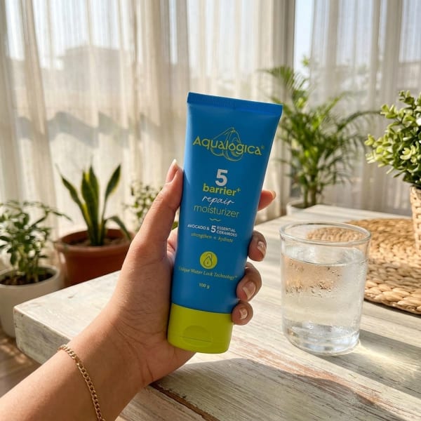 Aqualogica Freebie - 5 Barrier+ Repair Moisturizer with Avocado & 5 Essential Ceramides - 100g held in hand, candid photo