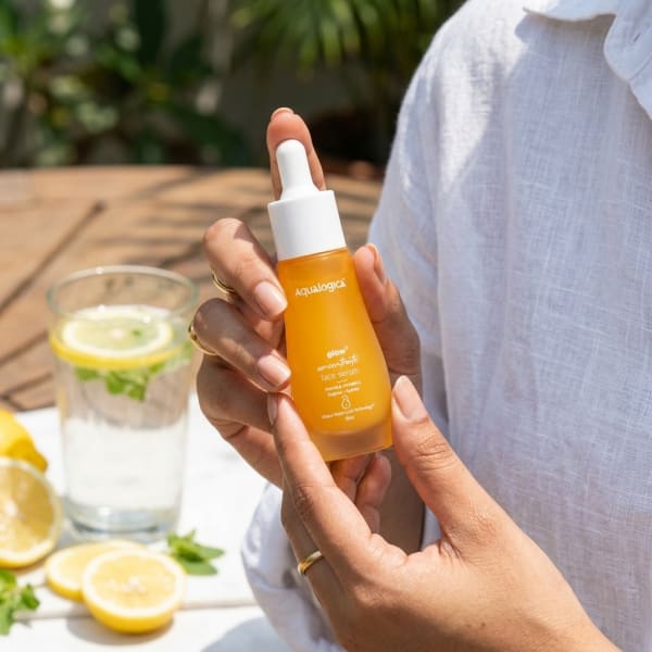 Aqualogica FREEBIE Glow+ Concentrate Face Serum 30 ml held in hand, candid photo