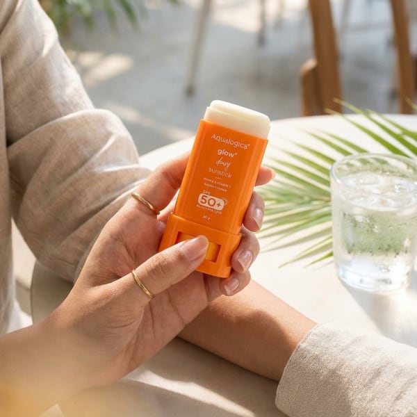 Aqualogica FREEBIE - Glow+ Dewy Sunstick - 20g held in hand, candid photo