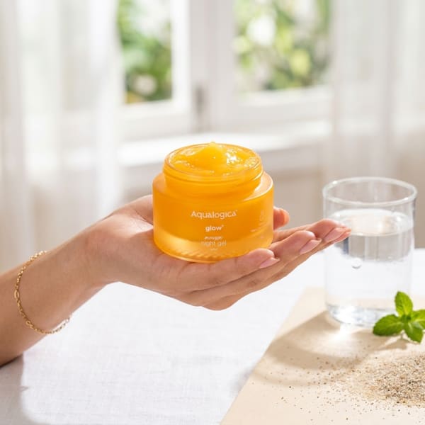Aqualogica FREEBIE Glow+ Mousse Night Gel 50 g held in hand, candid photo