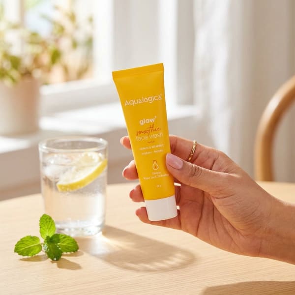 Aqualogica FREEBIE Glow+ Smoothie Face Wash 20g held in hand, candid photo