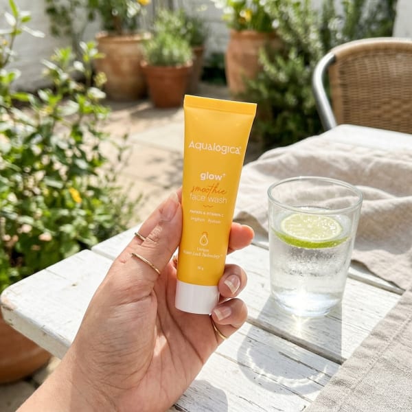 Aqualogica FREEBIE Glow+ Smoothie Face Wash 20g held in hand, candid photo