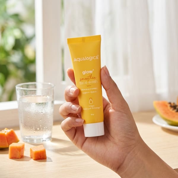 Aqualogica FREEBIE Glow+ Smoothie Face Wash 20g held in hand, candid photo