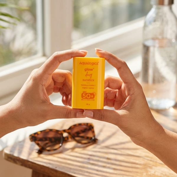 Aqualogica Glow+ Dewy Sunstick with SPF 50+ & PA++++ for Easy Reapplication & No White Cast - 20g held in hand, candid photo