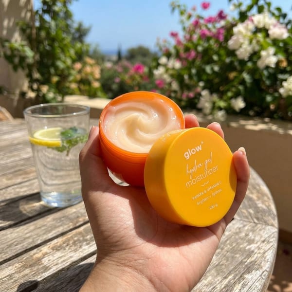 Aqualogica Glow+ Hydra Gel Moisturizer with Vitamin C & Papaya - 100 g held in hand, candid photo