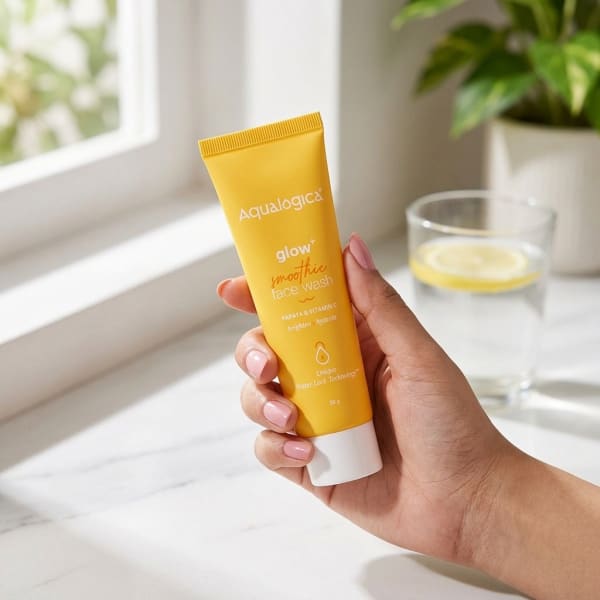 Aqualogica FREEBIE Glow+ Smoothie Face Wash 20g held in hand, candid photo