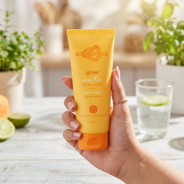 Aqualogica Glow+ Smoothie Face Wash with Papaya & Vitamin C for Glowing Skin - 100ml held in hand, candid photo