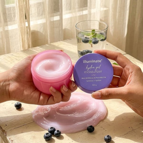 Aqualogica Illuminate + Hydra Gel Moisturizer with Wild Berries & Alpha Arbutin - 100g held in hand, candid photo
