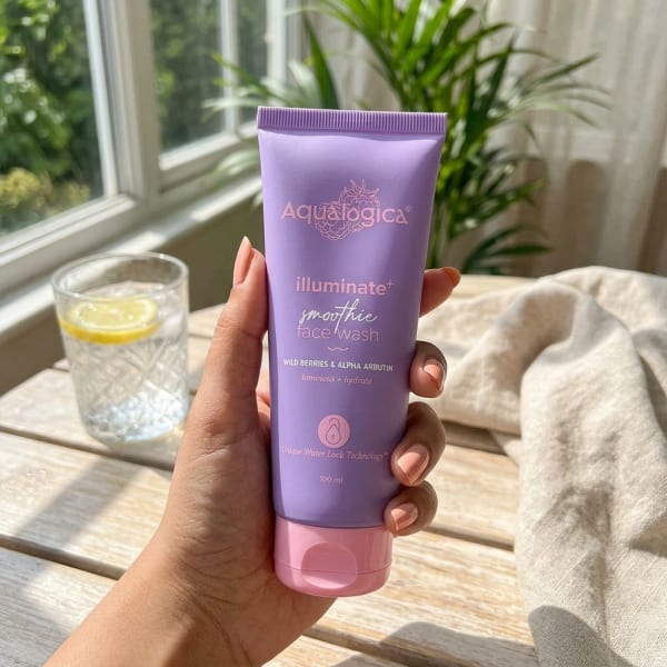 Aqualogica FREEBIE Illuminate+ Smoothie Face Wash - 100ml held in hand, candid photo