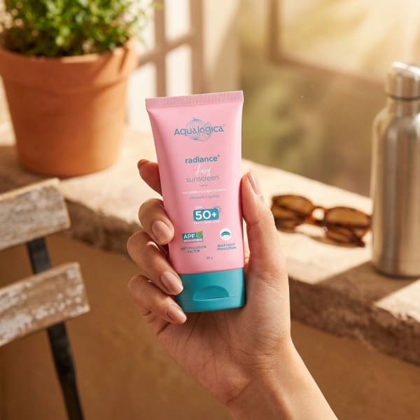 Aqualogica Radiance+ Dewy Sunscreen In-Vivo Tested with Watermelon & Niacinamide with SPF 50 & PA++++ - 30g held in hand, candid photo