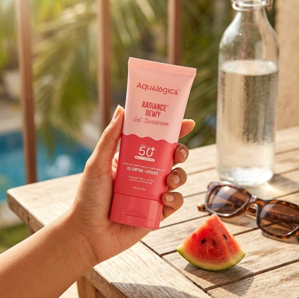 Aqualogica Radiance+ Dewy Sunscreen In-Vivo Tested with Watermelon & Niacinamide with SPF 50 & PA++++ - 80g held in hand, candid photo