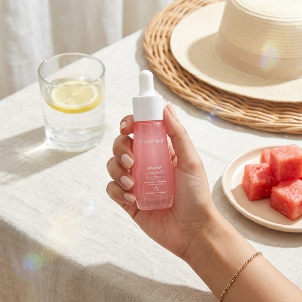 Aqualogica Radiance+ Concentrate Face Serum 30 ml held in hand, candid photo