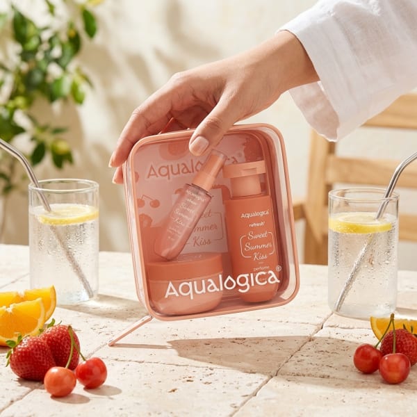 Aqualogica Refresh+ Body Care Set - Sweet Summer Kiss held in hand, candid photo