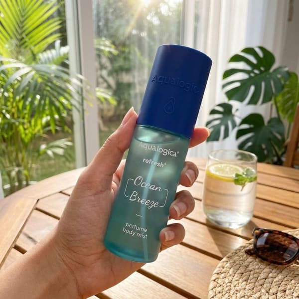 Aqualogica Refresh+ Perfume Body Mist - Ocean Breeze with Zemea & Hyaluronic Acid 150 ml held in hand, candid photo