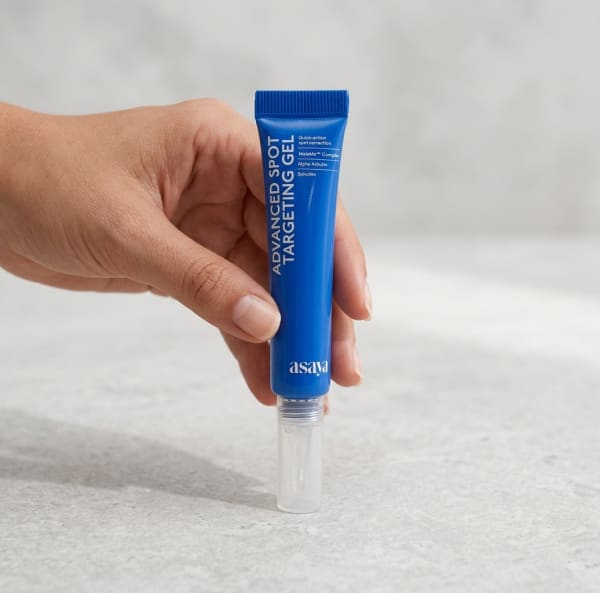 World of Asaya Advanced Spot Targeting Gel For Dark Spots & Acne Marks held in hand, candid photo