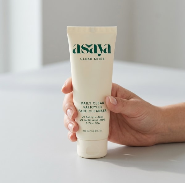 World of Asaya Daily Clear Salicylic Face Cleanser - Face Wash for Oily Skin held in hand, candid photo