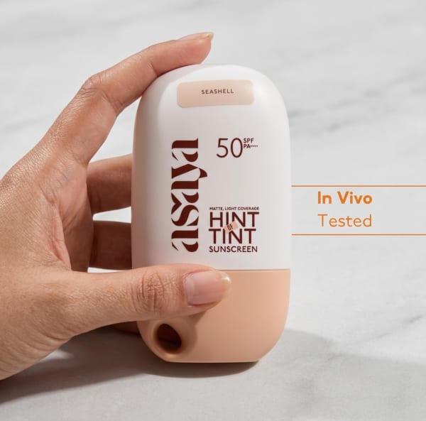 World of Asaya Hint of Tint held in hand, candid photo