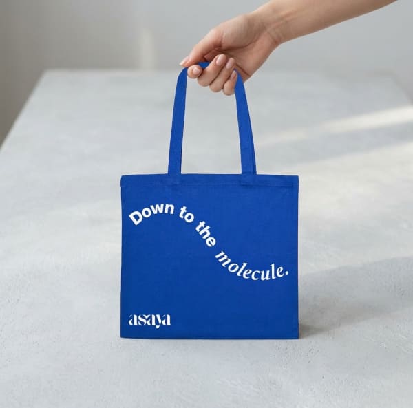 World of Asaya Tote Bag held in hand, candid photo