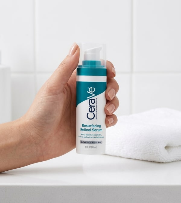 CeraVe Skin Renewing Retinol Serum held in hand, candid photo