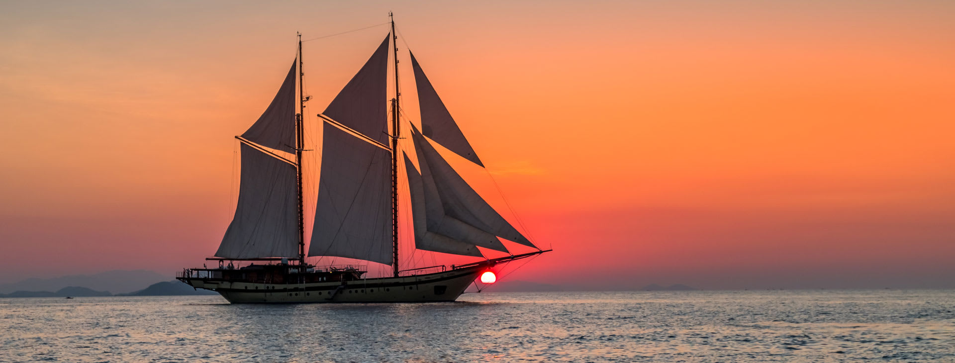 Sailing ship at sunset