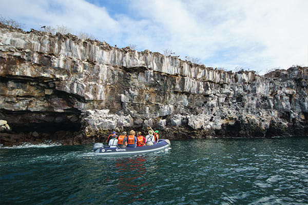 panga riding people galapagos