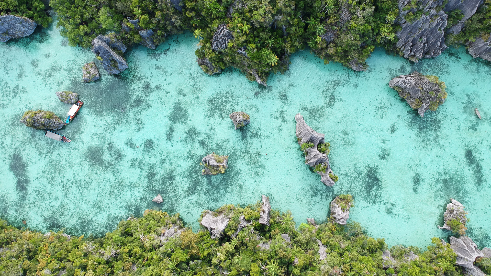Turquoise water and karst formations seen from above