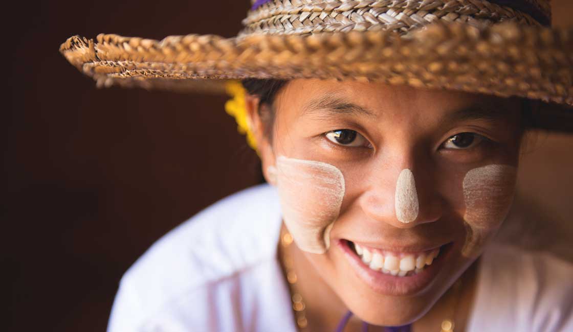 Young girl with thanaka paste on her face