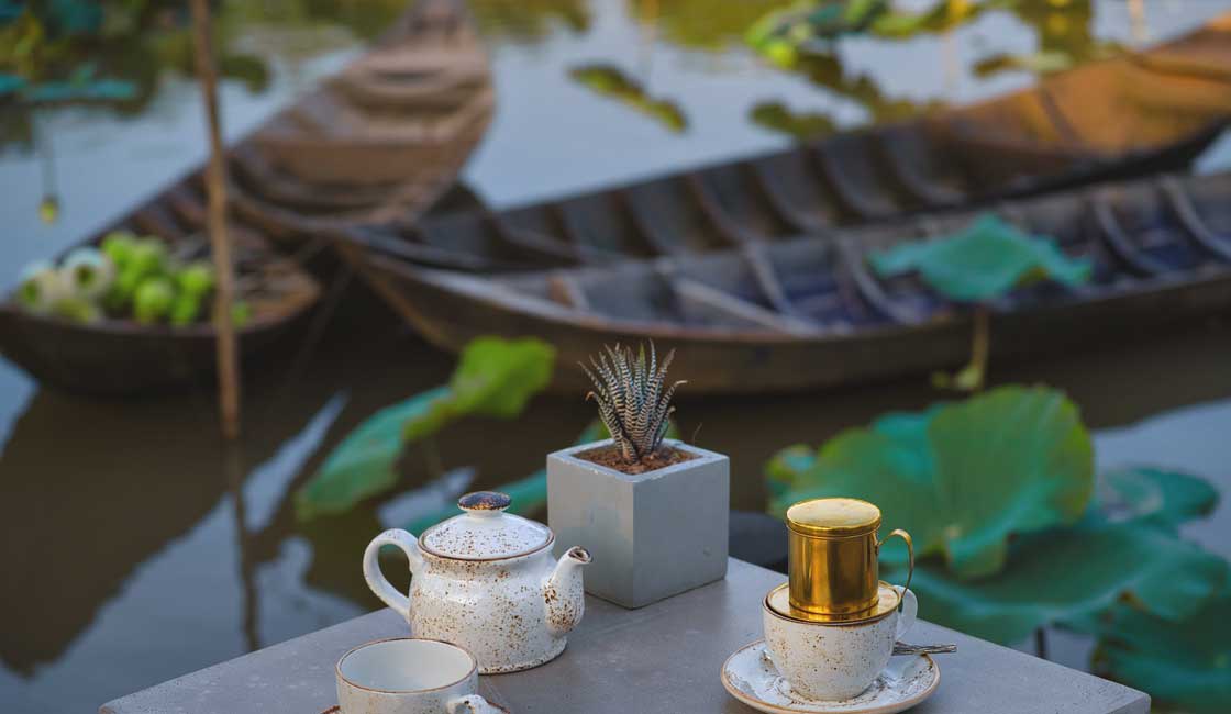 Coffee set on a table by the river