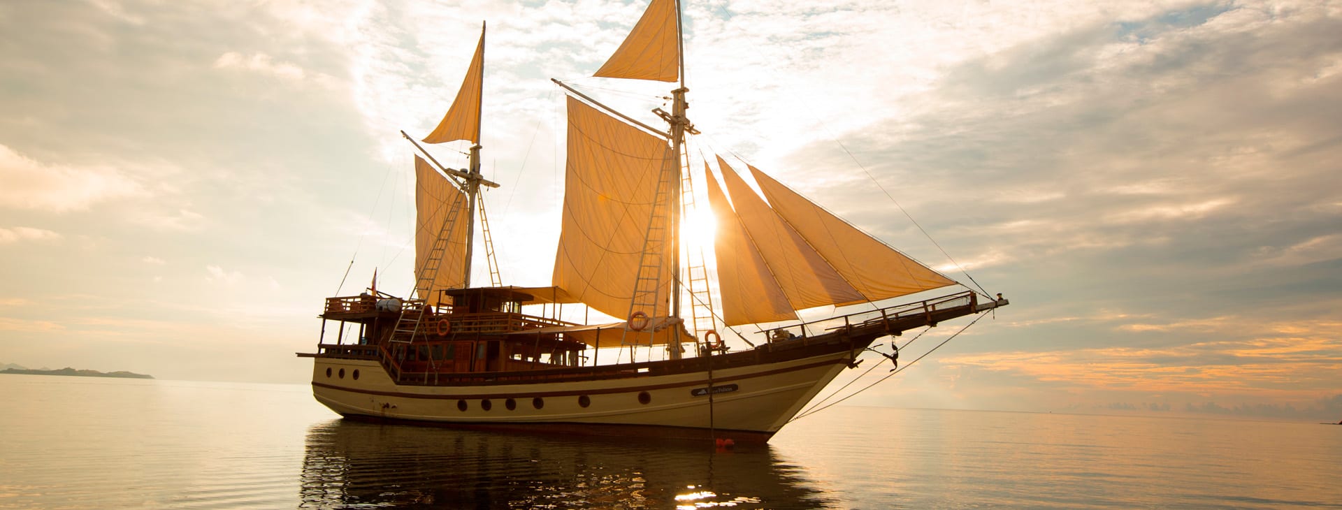 2 mast sailboat at sunset