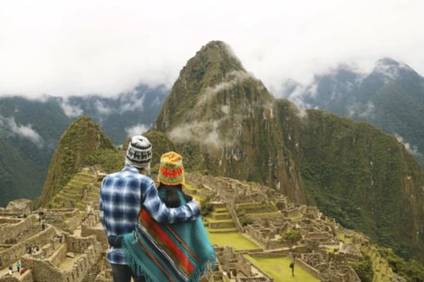 Tourists looking at Machu Picchu