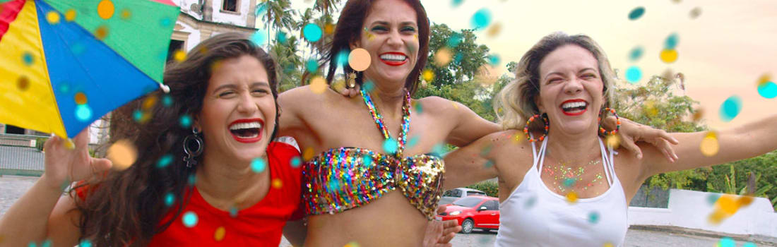 Three happy woman and confetti in the air