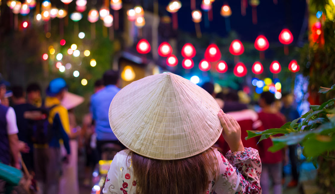 lady wearing a typical hat in a festival