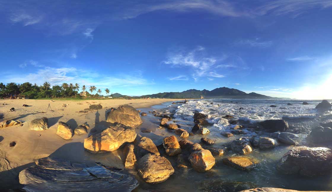 The wide-angle shot of a beach