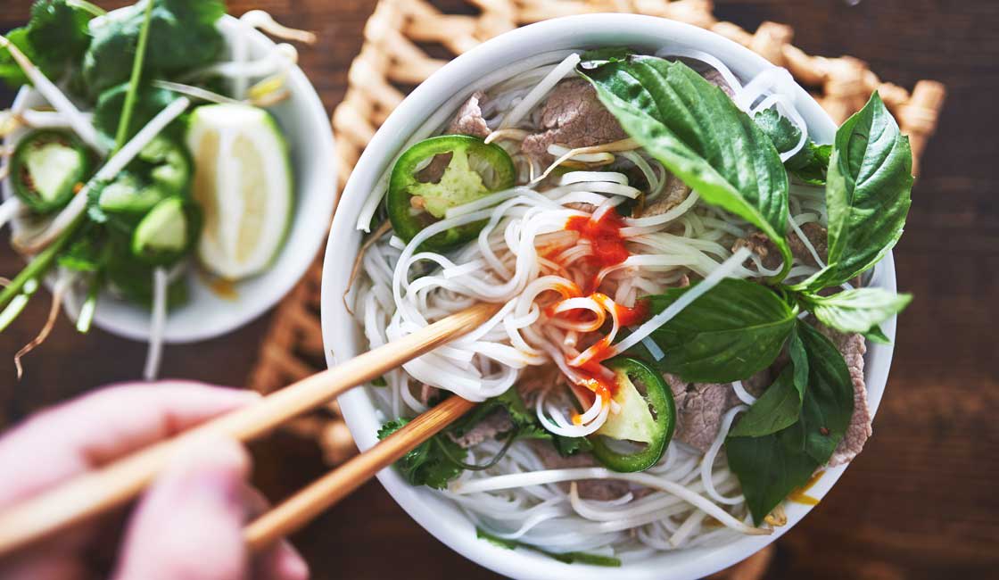 Bowl of noodle soup with chopsticks