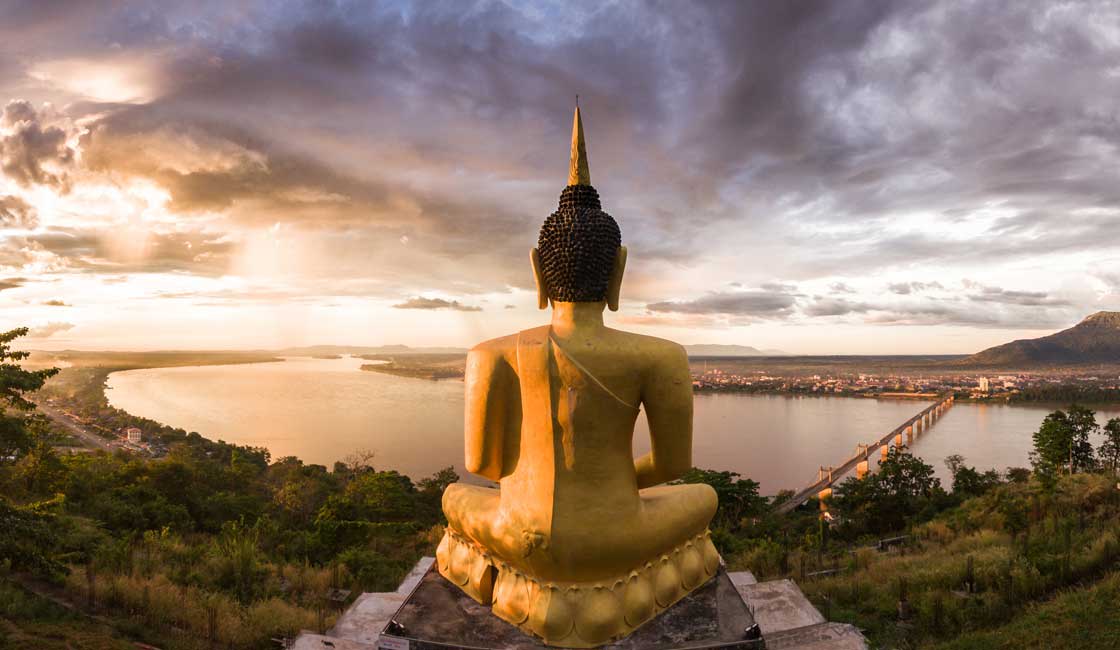 Buddha statue by the bank of the Mekong