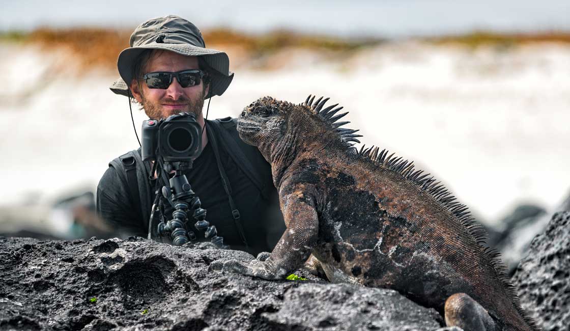 Photographer in front of Marine Iguana