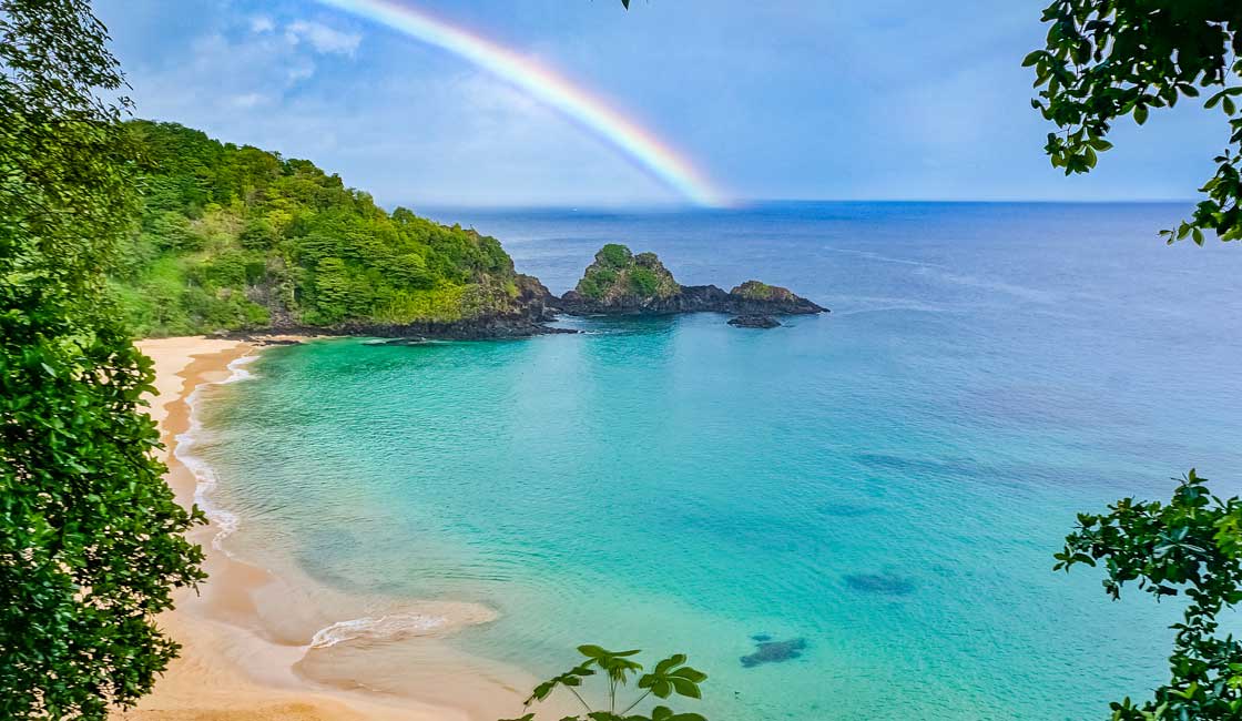 Rainbow over the tropical bay