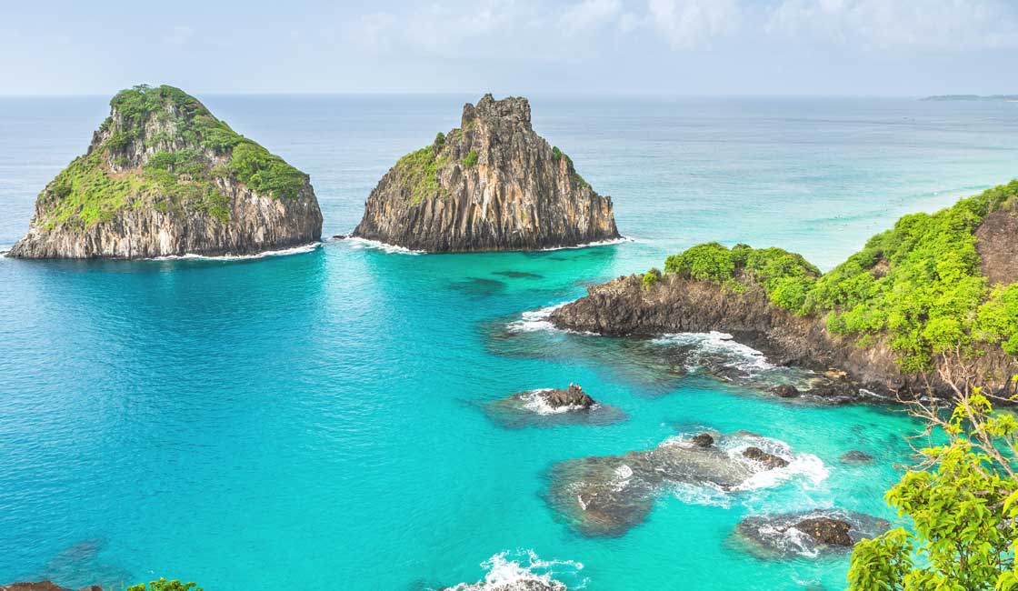 Karst formations over turquoise water