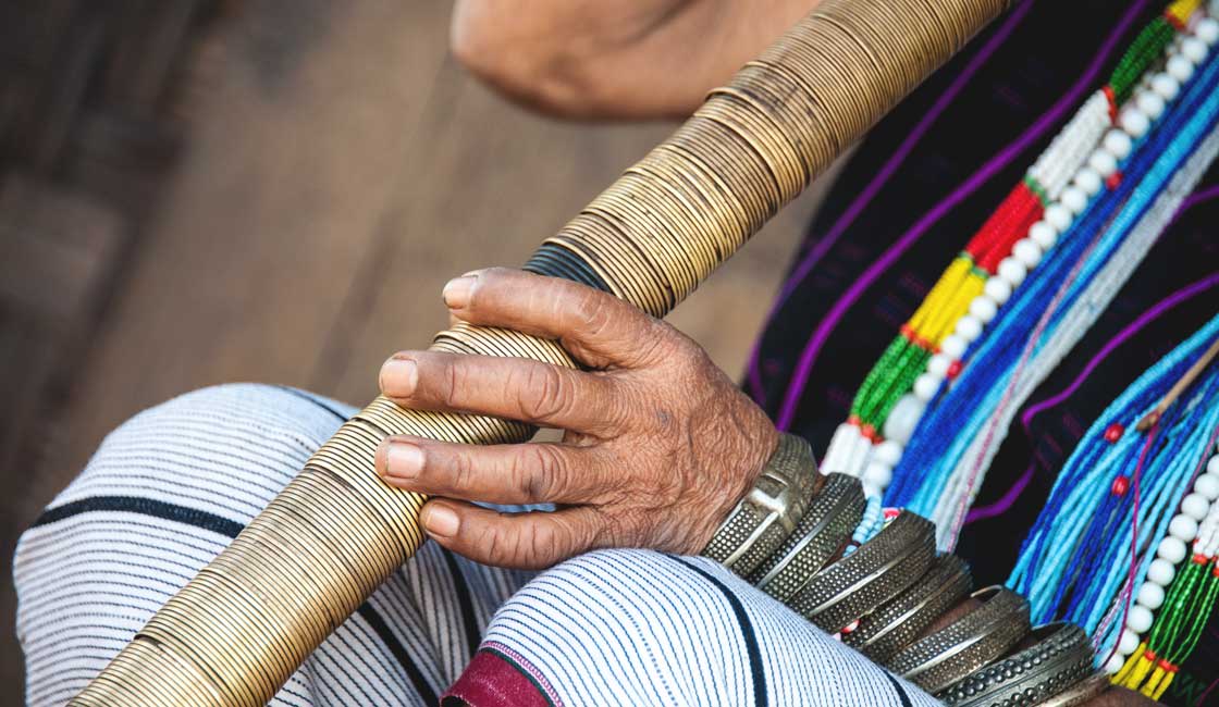 Hands holding a traditional pipes